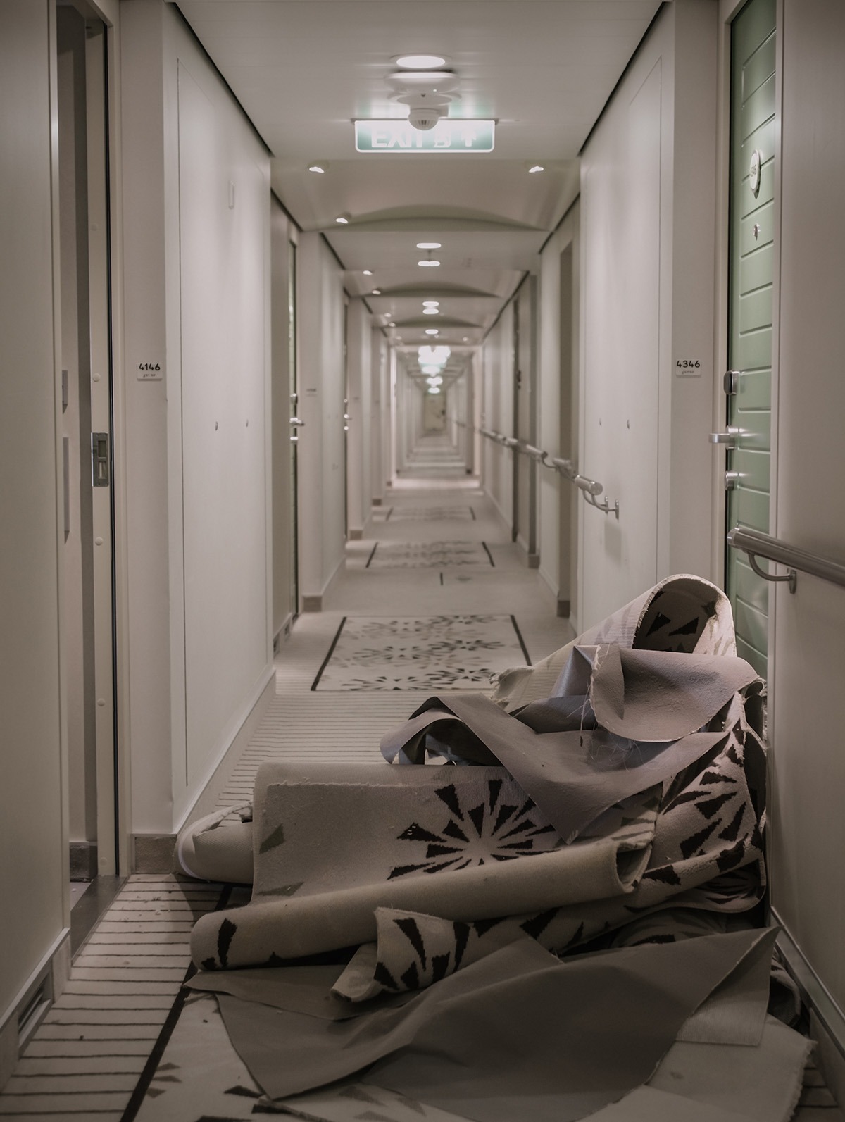 Used carpets in ship hallway: Preparing for recovery by Oceancircle.