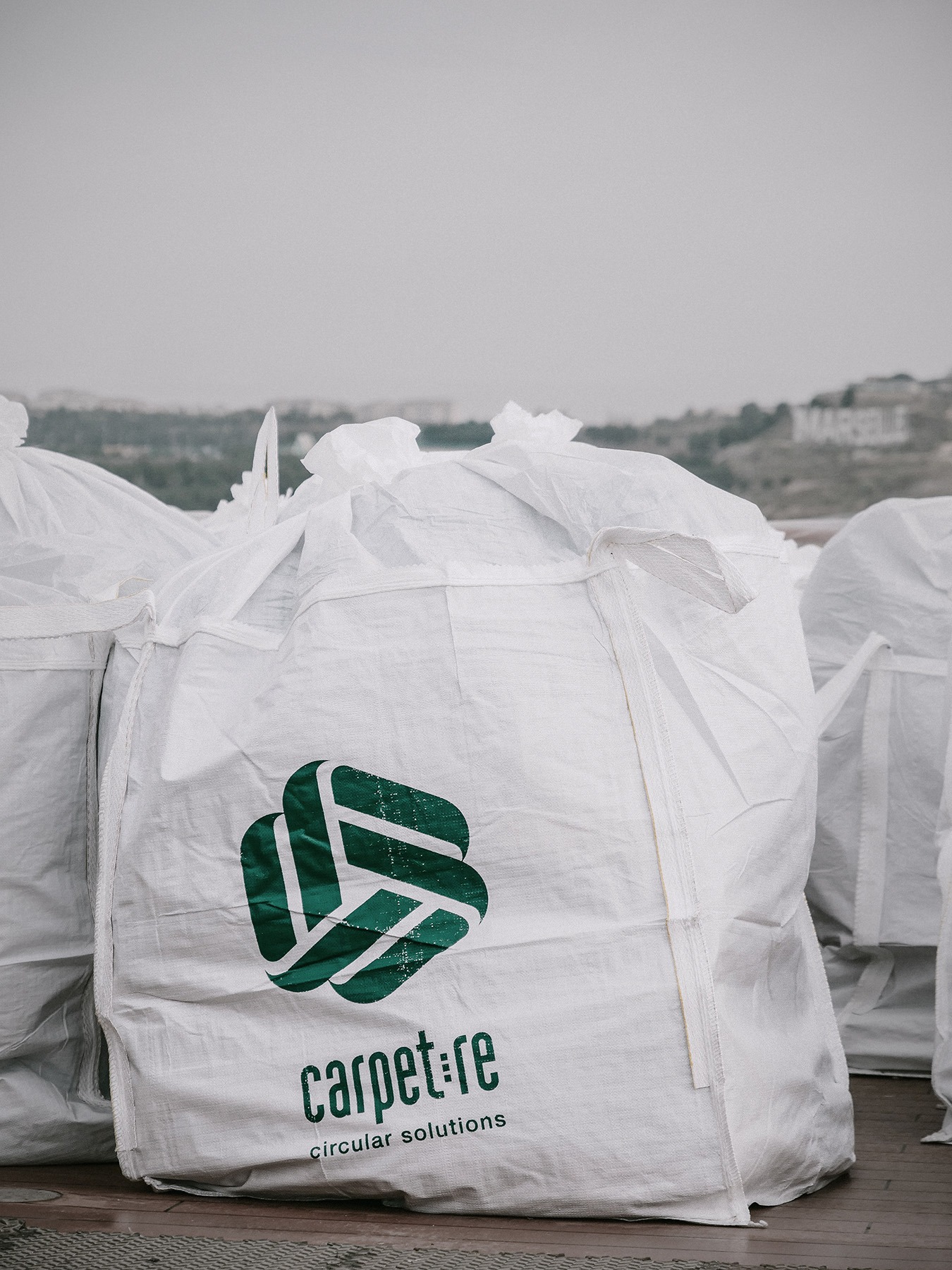 Recycling ship carpets: used carpets being prepared for further processing.