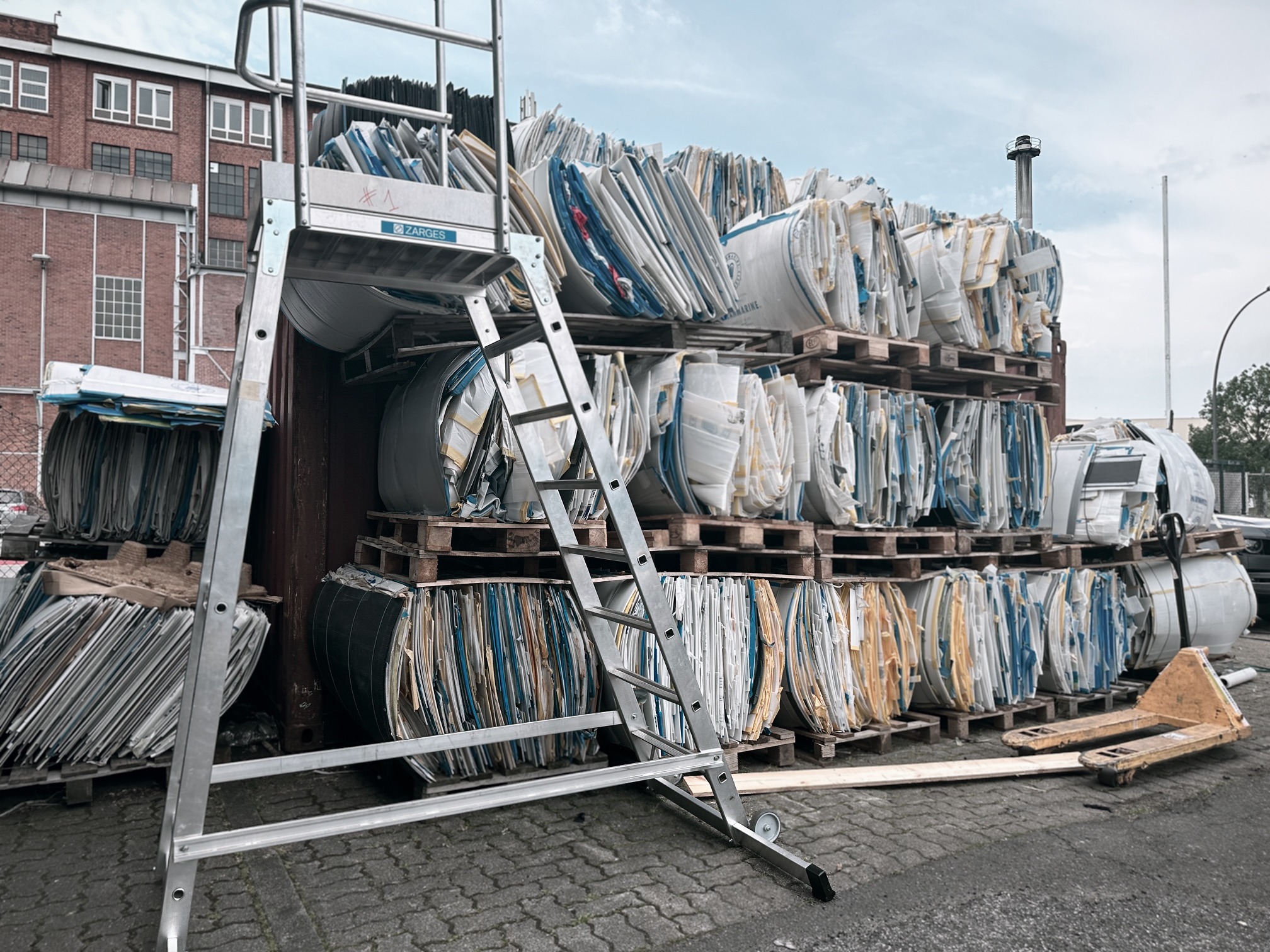 Protec:re plastic recycling: Pallets of compressed plastic waste from cruise and hospitality sectors.